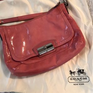 Pink Coach crossbody purse.